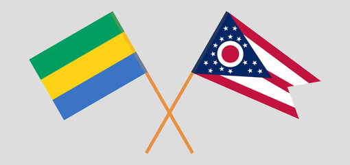 Crossed flags of Gabon and the State of Ohio. Official colors. Correct proportion