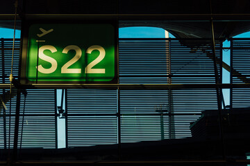 Fototapeta premium Boarding gate number sign at the airport. Travel concept.