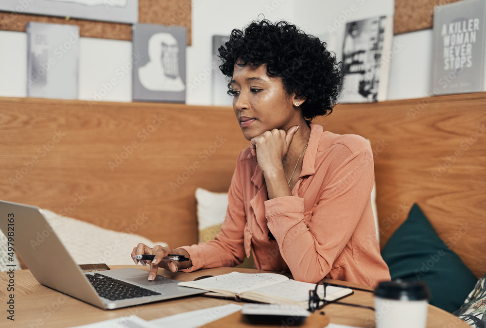 Poster that silly idea could turn into a successful business. shot of a businesswoman using her laptop whil