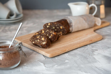 Homemade dessert of cookies, cream and cocoa - chocolate sausage