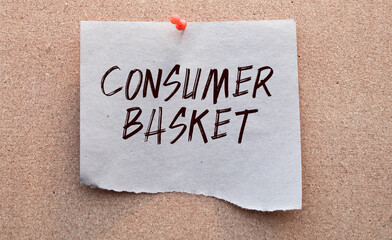 Shopping basket and text - Consumer basket, on white paper note list.