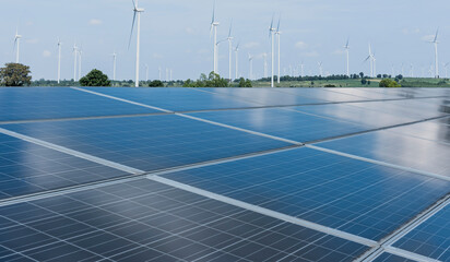 Solar energy panel photovoltaic cell and wind turbine farm power generator in nature landscape for production of renewable green energy is friendly industry. Clean sustainable development concept.