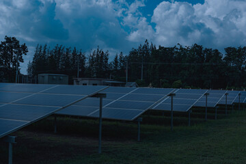 Night sky over unoccupied solar panels inside a solar fram.