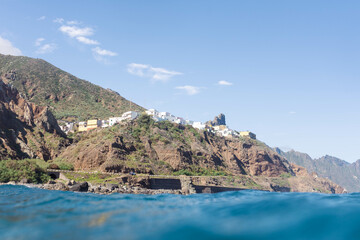 Low angle view of the town of Almaciga in Tenerife. Beautiful coastal town seen from the sea
