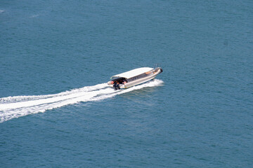 Fototapeta premium Motor boat, speedboat in the sea of ​​Brazil, aerial view