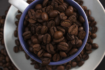 Cup full of coffee beans