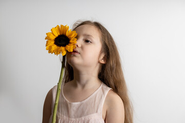 child with sunflower