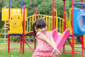 Portrait image of 4-5 years old childhood. Happy Asian child girl playing with the slider bar toy...