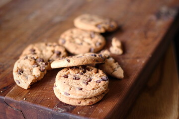 Delicious chocolate cookies placed on a wooden table