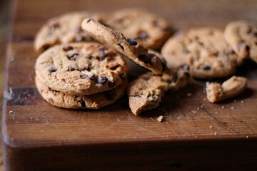 Delicious chocolate cookies placed on a wooden table