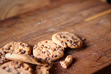 Delicious chocolate cookies placed on a wooden table