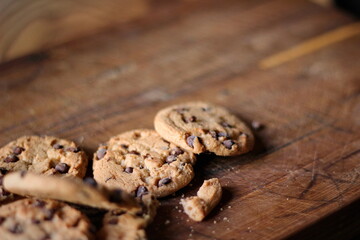 Delicious chocolate cookies placed on a wooden table