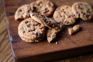 Delicious chocolate cookies placed on a wooden table
