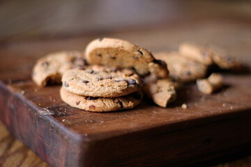 Delicious chocolate cookies placed on a wooden table