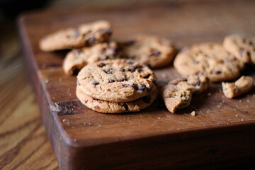 Delicious chocolate cookies placed on a wooden table