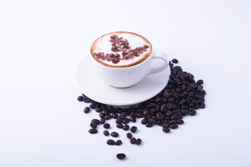 Coffee cup and coffee beans on wooden table.