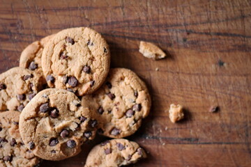 Delicious chocolate cookies placed on a wooden table