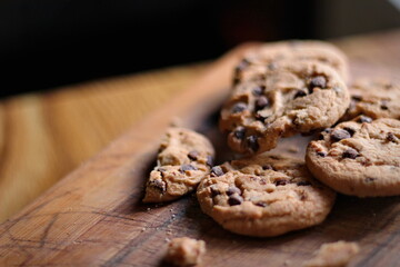Delicious chocolate cookies placed on a wooden table