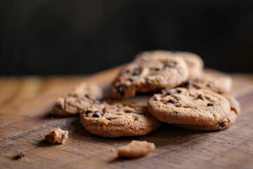 Delicious chocolate cookies placed on a wooden table