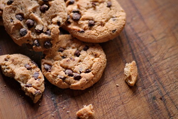 Delicious chocolate cookies placed on a wooden table