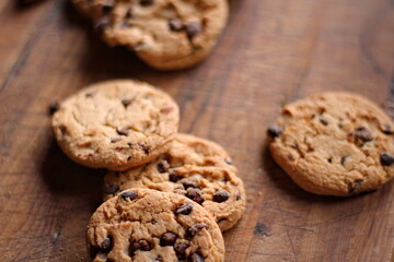 Delicious chocolate cookies placed on a wooden table