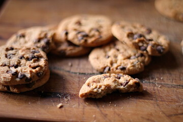 Delicious chocolate cookies placed on a wooden table