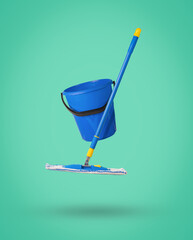 Minimal cleaning concept. A blue floor mop and a blue bucket levitating on a green background.