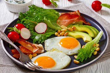 fried eggs, lettuce, avocado, radish, peanuts, ham