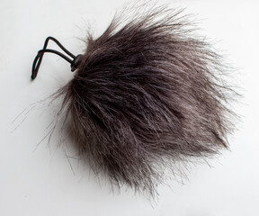 Windscreen or windshield. Fur filter for microphone on white background isolation. Audio recording accessories