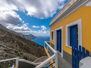 A blue, white and yellow ocher painted house at Olympus town, Karpathos, Greece.