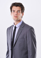 Lets talk business. Studio shot of a handsome young businessman against a white background.