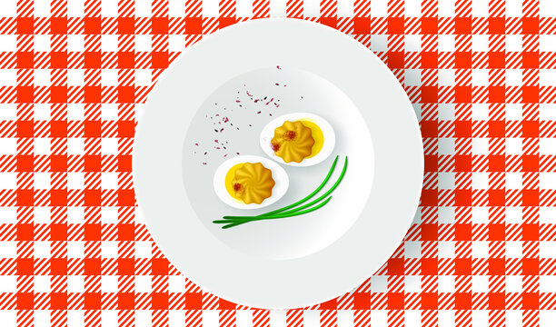 Deviled eggs with mayonnaise and paprika on white plate. Breakfast table, top view
