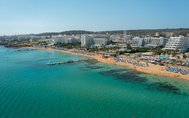 Fototapeta na wymiar Beaches and hotels of the first line of the Mediterranean Sea in Protaras, Cyprus, aerial view