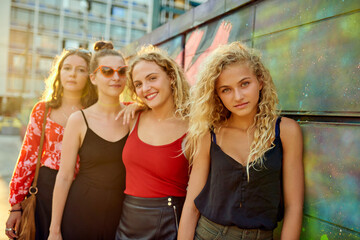 Lined up in the city. Cropped portrait of a group of attractive young girlfriends having a great...