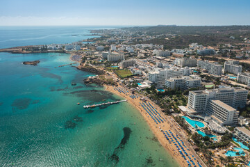 Fototapeta premium Beaches and hotels of the first line of the Mediterranean Sea in Protaras, Cyprus, aerial view