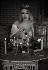 Gypsy woman with a Tarot cards, other witch stuff, concept of occultism and fate prediction 