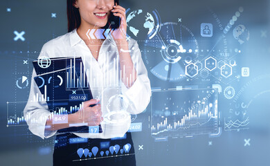 Businesswoman is talking on smartphone watching at digital inter