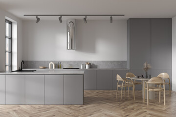 Front view on bright kitchen room interior with dining table
