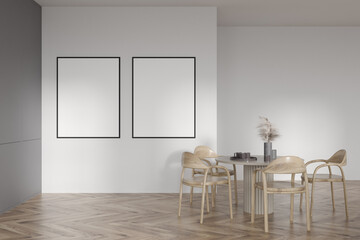 Bright kitchen room interior with two empty white posters