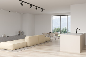 Corner view on bright studio room interior with dining table