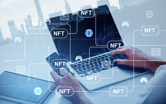 Businessman holding smartphone typing on laptop. Digital interface with nft - Powered by Adobe