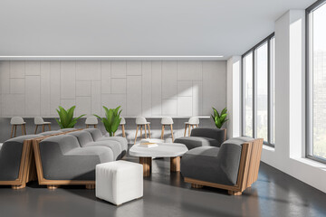 Light cafe interior with chairs, couch and table, window on city view