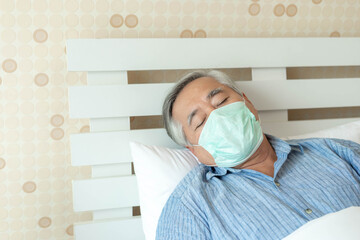 Elderly patients in bed, Asian senior man patients wearing Face Mask- medical and healthcare concept