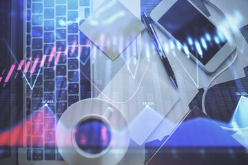 Double exposure of financial chart drawing over table background with computer. Concept of research and analysis. Top view.