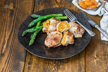 Chicken thighs with appricot stuffing and asparagus