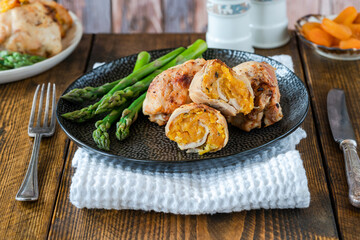 Chicken thighs with appricot stuffing and asparagus