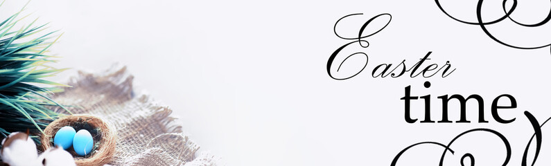 Bird's nest with eggs. Willow branches and first greens. Easter background. Palm Sunday. Christian holiday. Spring background.