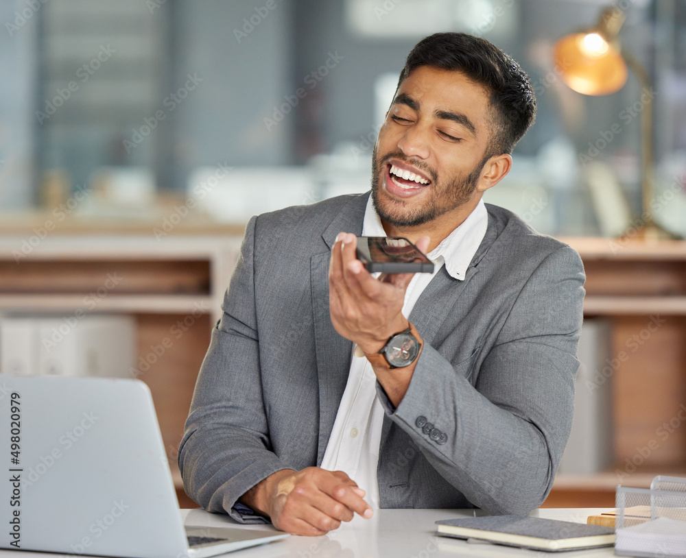 Poster let nothing out-hustle your hard work. shot of a young businessman using a smartphone and laptop in 