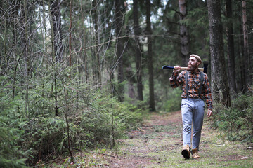 Fototapeta premium A bearded lumberjack with a large ax