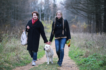 Young girl on a walk in the autumn